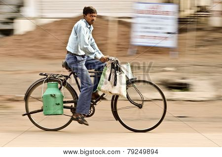 Indian Man Rides On Bicycle , Panning A Camera