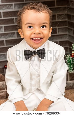African American Boy Gentleman By Fireplace. Christmas And New Year