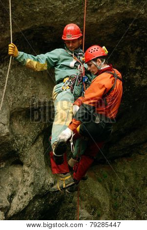 Cavers work out rescue operations in caves.