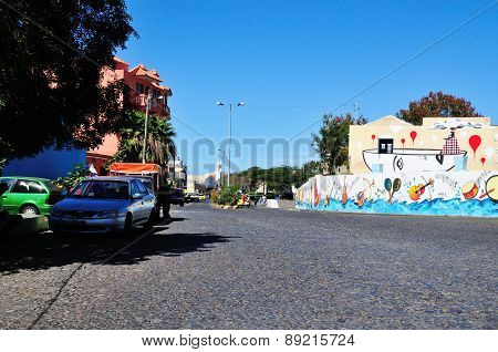 Cars Parked By The Cobblestone Street