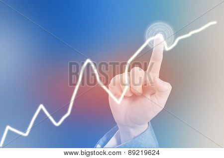 Hand Of Asian Business Man Pointing A Line Graph On A Virtual Touch Screen