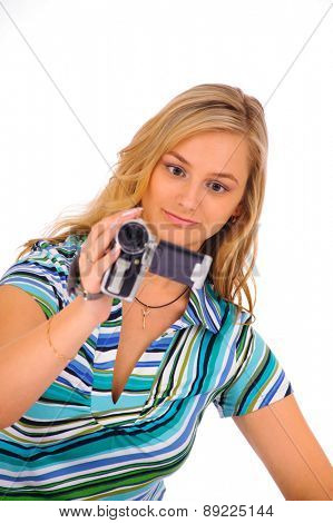 Studio shot of young blone woman with digital camcorder