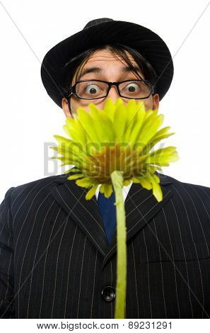 Young man in black costume with flower isolated on white