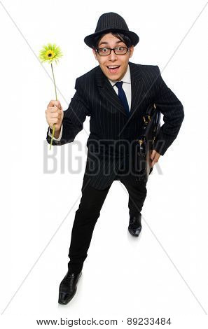 Young man in black costume with flower isolated on white