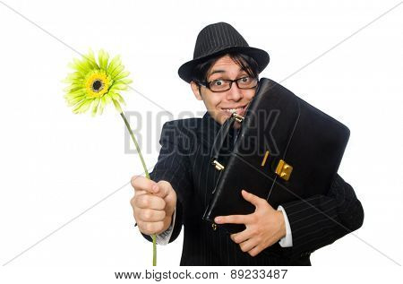 Young man in black costume with flower isolated on white