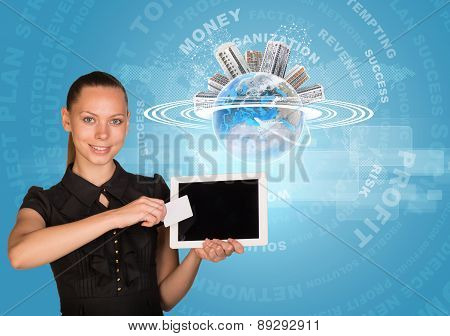 Businesswoman holging tablet and card