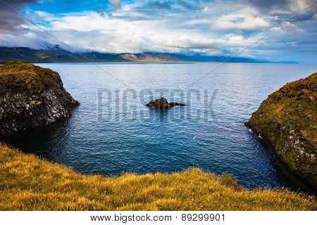 The picturesque coastal bay near the fishing village of Arnastapi. Iceland in summer