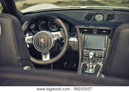 Sleza, Poland, August 15, 2015: Close Up On Porsche 911 Carrera S Car Steering Wheel And Cockpit  Mo