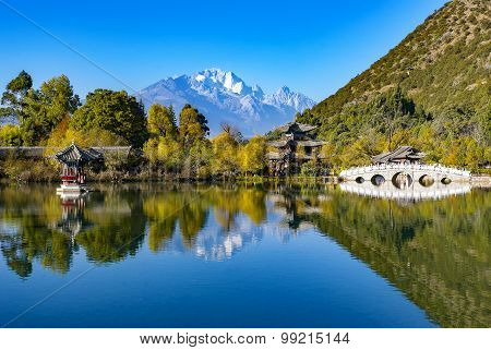 Reflection of Jade Dragon snow mountain on the lake in with  China