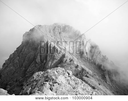 clouds over mytikas peak greece black and white