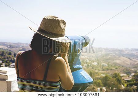 Woman Looking At Landscape Through A Telescope. Vintage Tone.