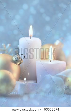 Light Christmas Decorations with Candles, baubles and magic snow background