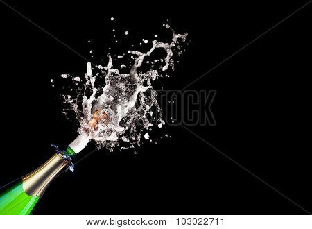 detail of popping champagne on black background