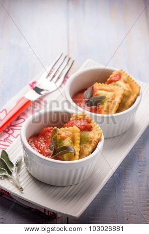 fried ravioli with tomatoes sauce, selective focus