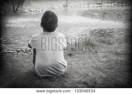 An Asian boy scared and alone