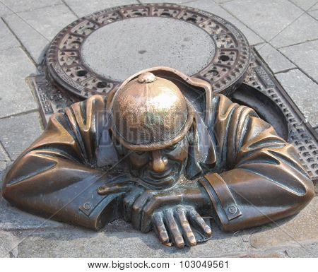Bronze Man Emerging from Sewer
