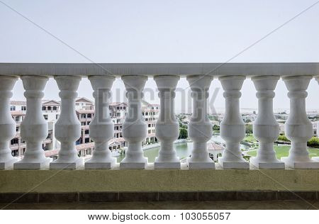 View of the city through old style balustrade.