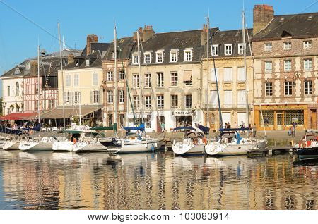 Beautiful yachts at the Honfleur harbor and old city