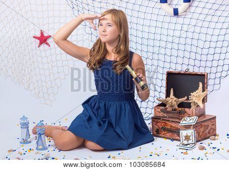 Beautiful teen girl looking afar with telescope in her hand