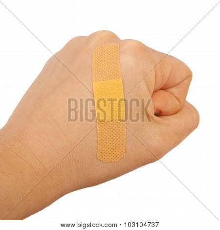 On a man's hand fist glued medical plaster first