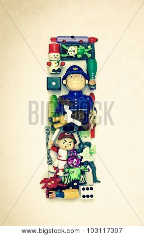 the letter   I  made from small toys
