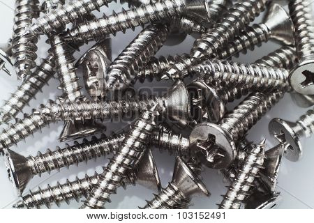 Pile of Metal Screws Background