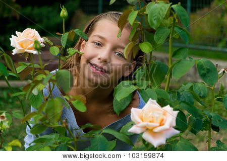 Little Cute Gypsy Child Girl Between Roses Happy Smiling Pretty
