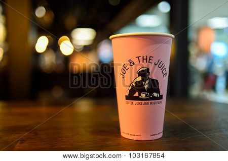 NICE, FRANCE - AUGUST 15, 2015: close up shot of Joe and the Juice cafe cup. Joe and the Juice's biggest cup is pink color.