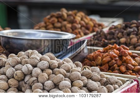 Dry Fruits And Spices Like Cashews, Raisins, Cloves, Anise, Etc. On Display For Sale In A Bazaar In