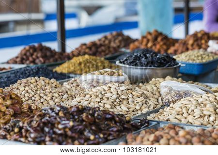 Dry Fruits And Spices Like Cashews, Raisins, Cloves, Anise, Etc. On Display For Sale In A Bazaar In