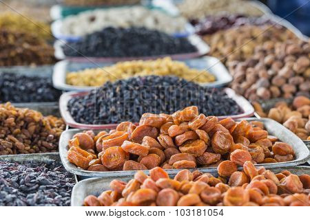 Dry Fruits And Spices Like Cashews, Raisins, Cloves, Anise, Etc. On Display For Sale In A Bazaar In