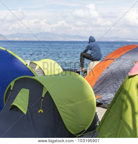 KOS, GREECE - SEP 28, 2015: Tents war refugees in the port of Kos island. Kos island is located just 4 kilometers from the Turkish coast, and many refugees come from Turkey in an inflatable boats.