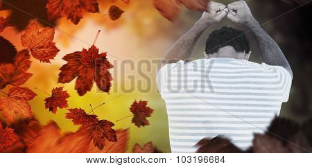 Upset man leaning on white background against autumn scene