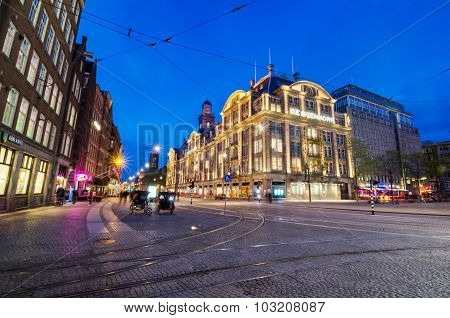 Amsterdam, Netherlands - May 7, 2015: Tourist Visit De Bijenkorf Store On Dam Square