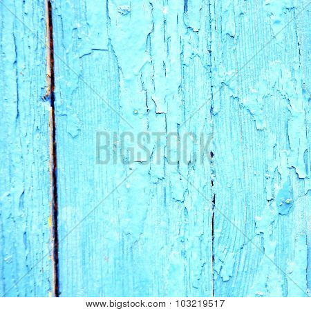 Dirty Stripped Paint In The Blue Wood Door And Rusty Nail