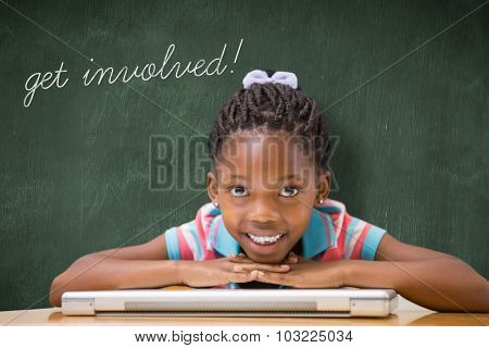 The word get involved! and smiling pupil sitting at her desk against green chalkboard