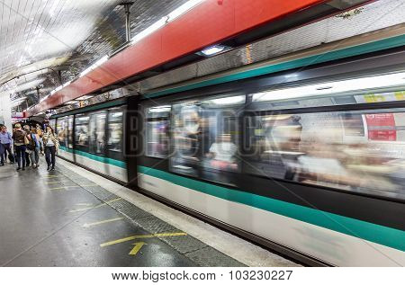 Travellers And Commuters Waiting At Subway Station