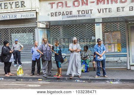 People Of Different Nationalities Wait At The Bus Stop In Marseille