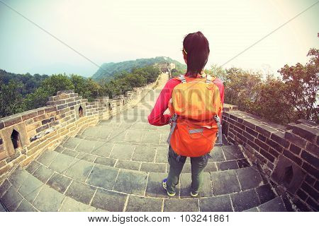 woman hiker hiking on chinese great wall