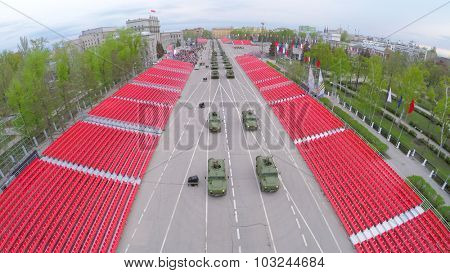 SAMARA - MAY 06, 2015: Military hardware moves along empty tribunes at spring evening. Aerial view video frame