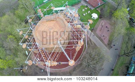 MOSCOW - MAY 04, 2015: People walk by alleys near Tall Rope Park Skytown in VDNH at spring cloudy day. Aerial view video frame