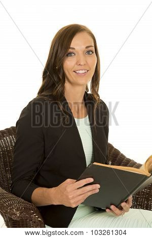 Woman Black Jacket In Chair With Book Look Smiling