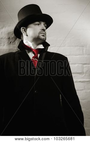 Man In The Black Coat, Top Hat And In A Red Tie