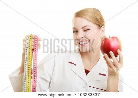 Doctor Specialist Holding Fruit Apple And Measure Tape