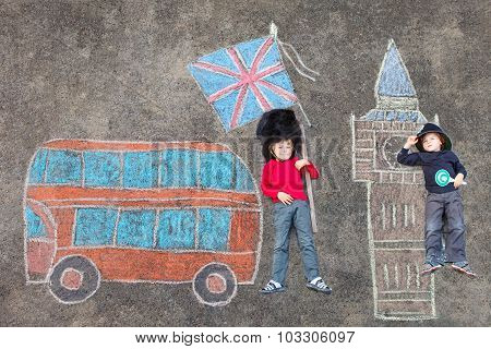 Two Kid Boys In British Soldier Policeman Uniform With London Pi