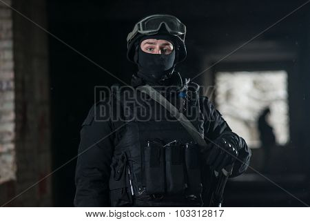 Fully equipped military men with automatic weapons playing airsoft strikeball