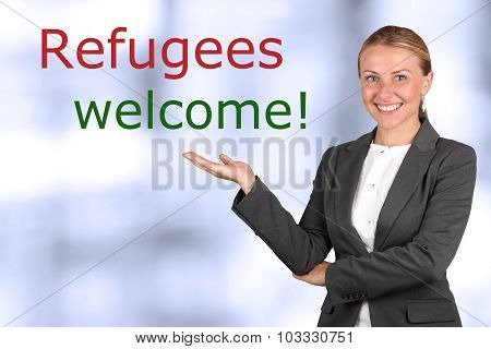 Smiling Woman  Showing To Sign 