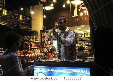 Turkish seller sale icecream to a man on the street