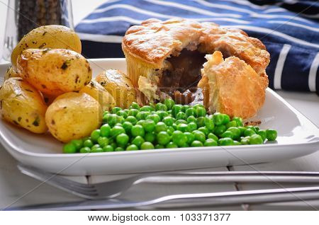Meat Pie With New Potatoes And Peas.