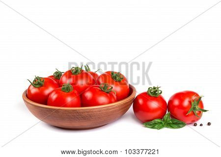 Fresh Tomatoes In A Bowl With Basil Isolated